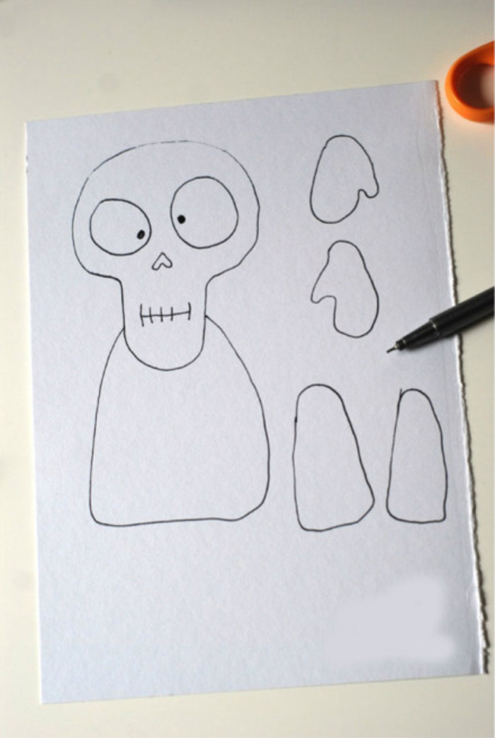 用纸片制作的骷髅手工纸艺教程图解 有点吓人但又有趣的骷髅纸片小人偶_www.youyix.com