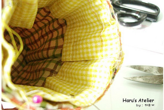 精美好看的束口袋做法步骤图解 手工DIY制作出漂亮实惠的圆筒束口袋教程_www.youyix.com